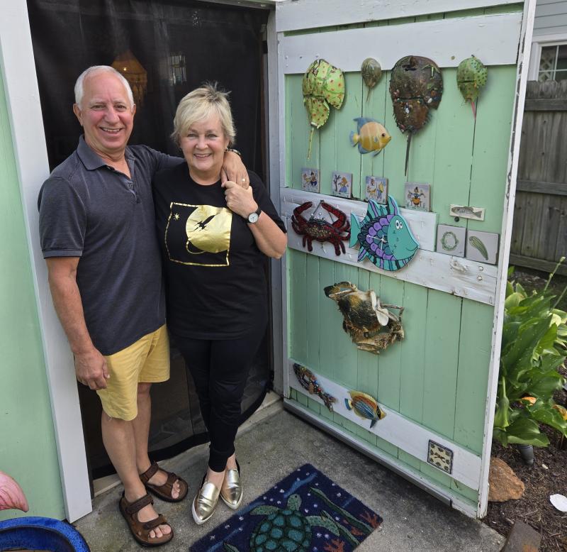 Jim Semivan and Deb Stokes stand in the doorway of her she shed. Notice her alien gold slippers. JEFF SEEMANS PHOTOS
